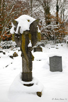 Snow-Covered Gravestone Statue